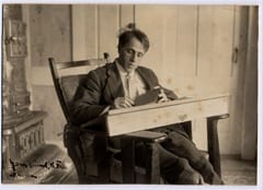 Robert Frost at his desk in Franconia